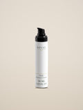 REVAX Daily Recovery Cream 50 ml bottle with black pump on a warm cream background, front view