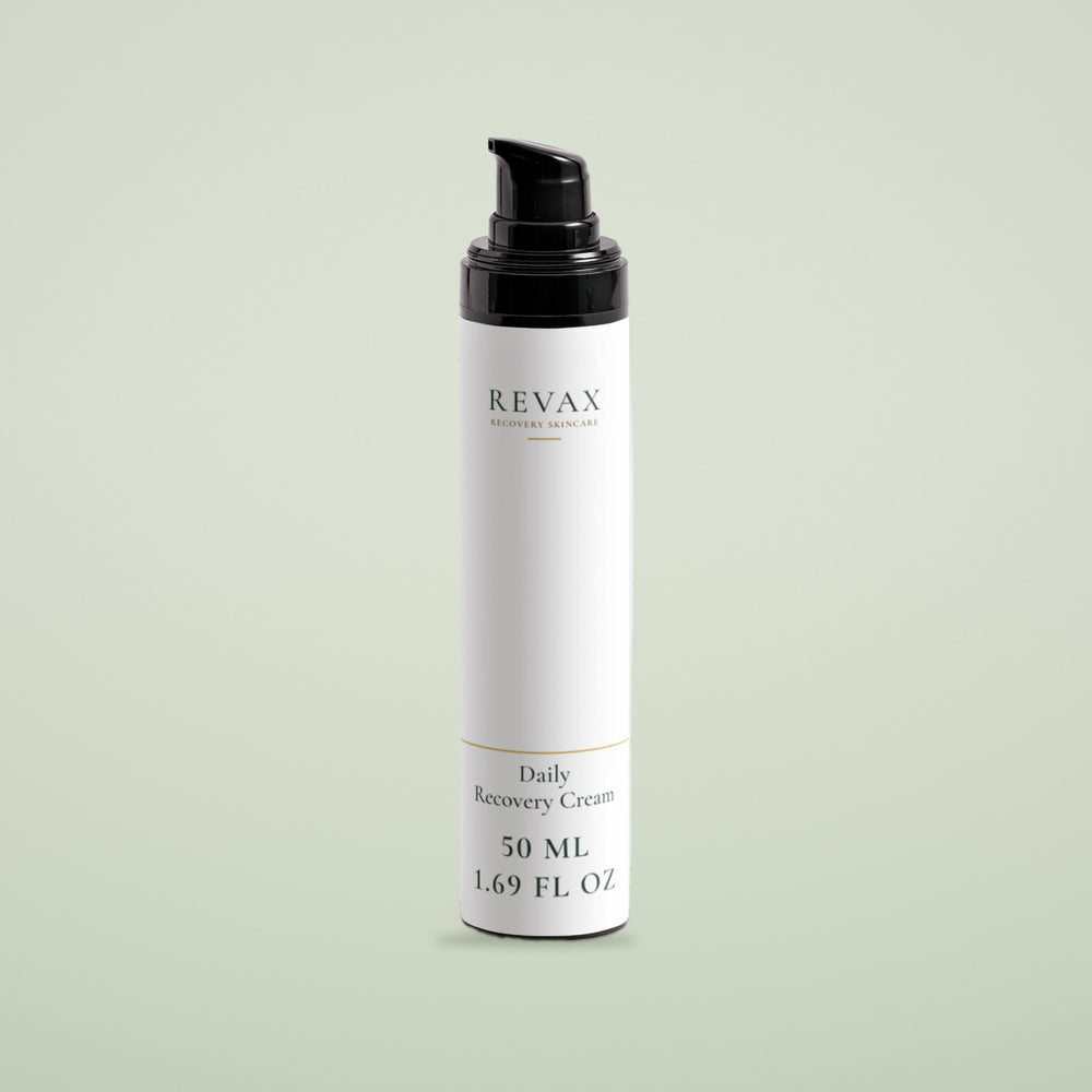 REVAX Daily Recovery Cream 50 ml, white bottle with black pump on a soft sage background, front view