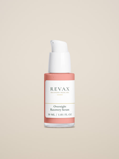 REVAX Overnight Recovery Serum 30 ml, clear pump bottle alone on a warm sand background, close front view